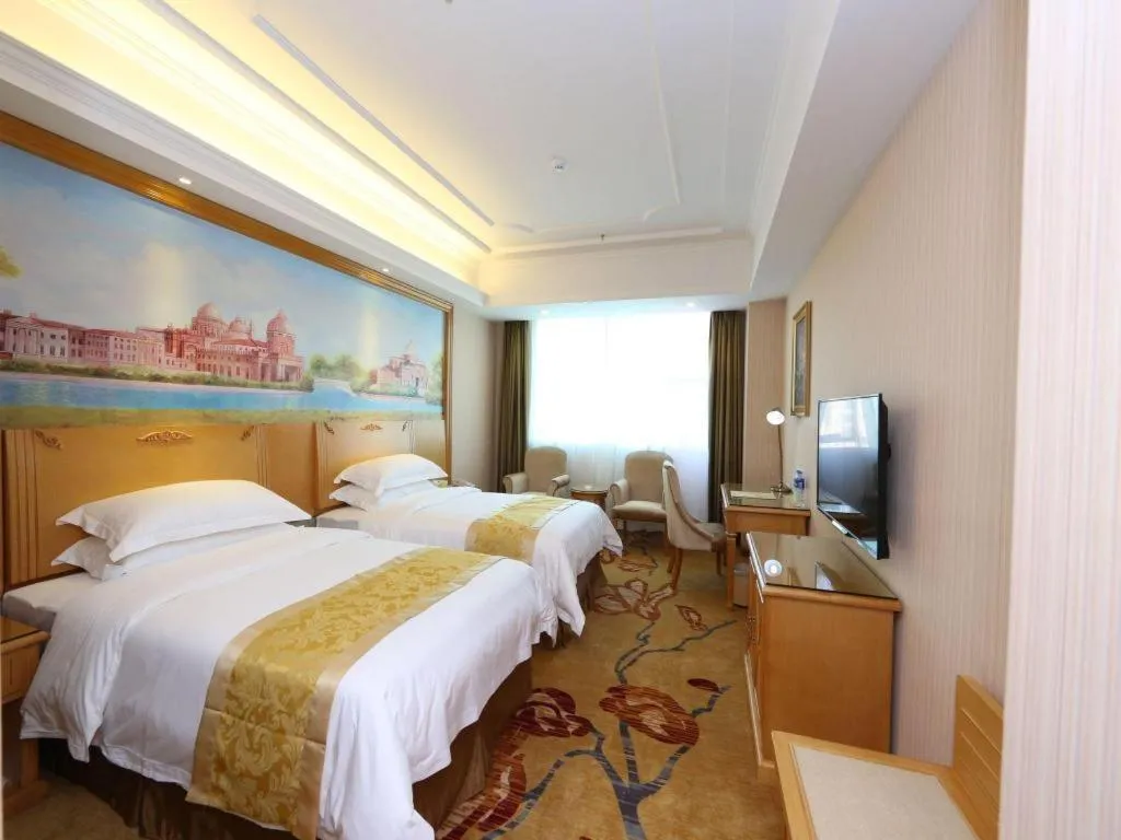 Bed in Vienna Hotel Guangzhou Panyu Shiqiao Center Branch