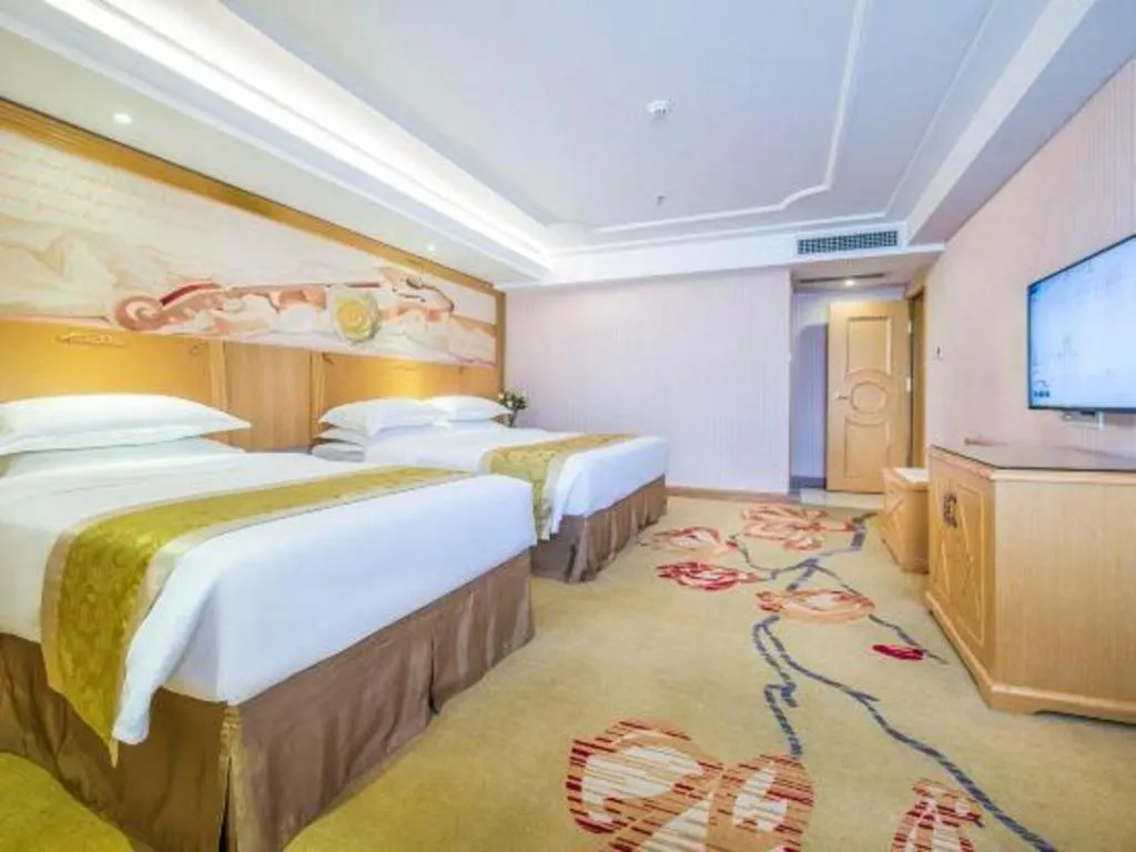 Bed in Vienna Hotel Guangzhou Panyu Shiqiao Center Branch