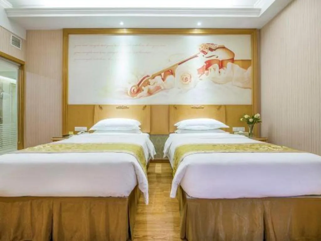 Bed in Vienna Hotel Guangzhou Panyu Shiqiao Center Branch