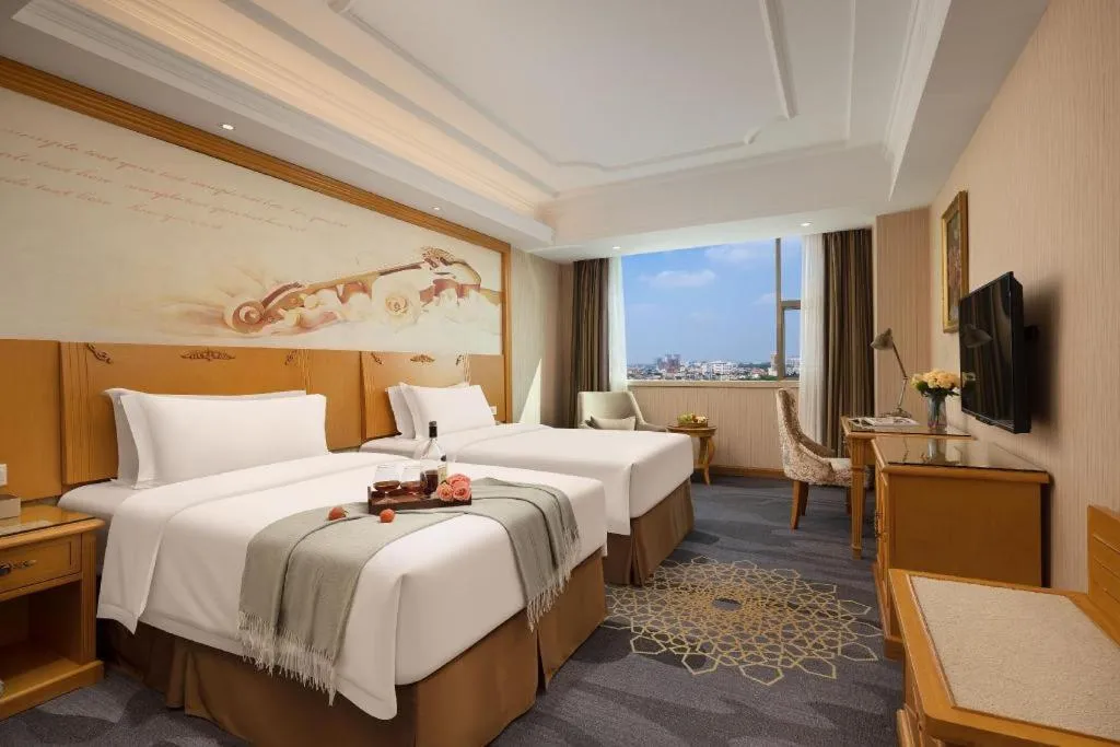 Bed in Vienna Hotel Guangzhou Panyu Shiqiao Center Branch