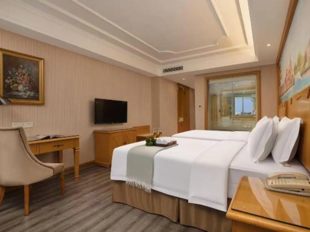 Bed in Vienna Hotel Guangzhou Panyu Shiqiao Center Branch