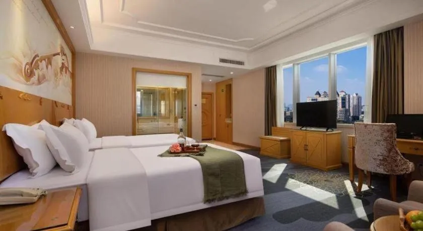 Bed in Vienna Hotel Guangzhou Panyu Shiqiao Center Branch