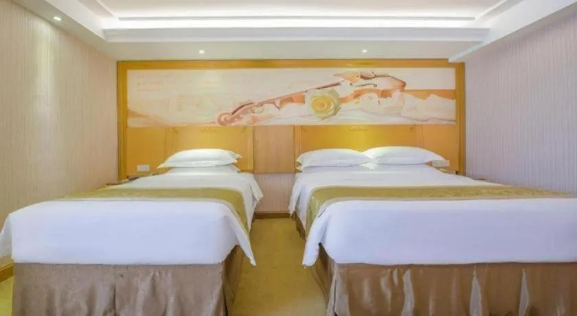 Bed in Vienna Hotel Guangzhou Panyu Shiqiao Center Branch
