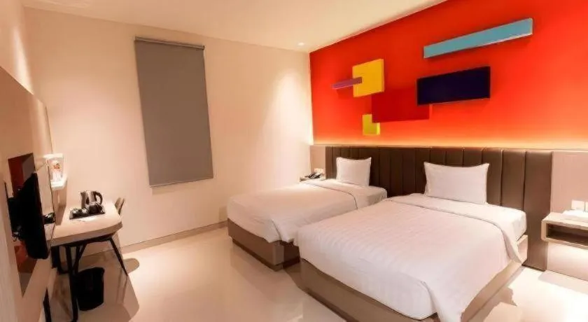 Bed in Zoom Dharmahusada Hotel