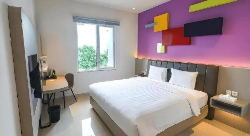 Bed in Zoom Dharmahusada Hotel