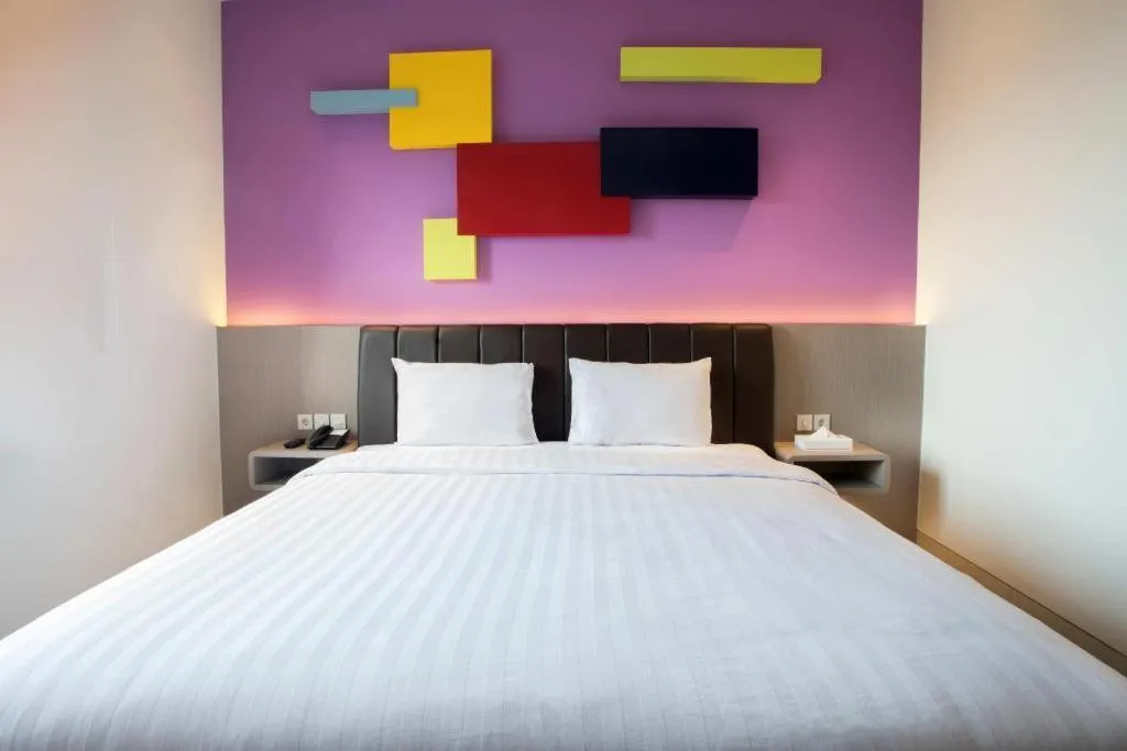 Bed in Zoom Dharmahusada Hotel