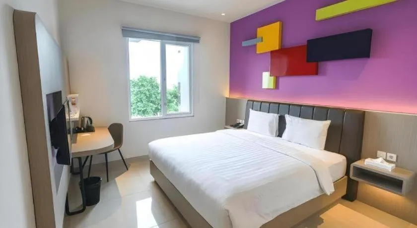 Bed in Zoom Dharmahusada Hotel