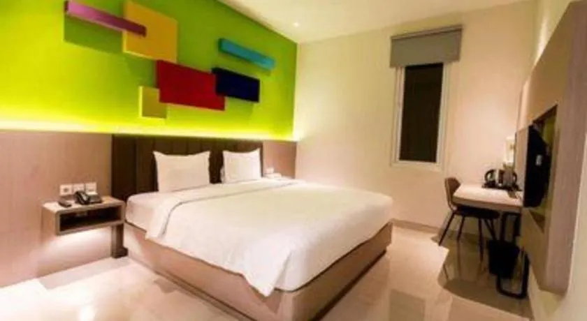 Bed in Zoom Dharmahusada Hotel