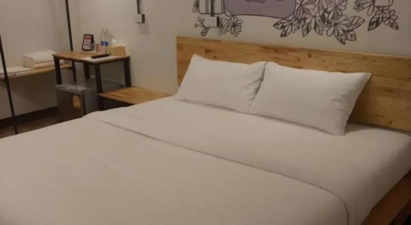 Bed in QBix Hotel