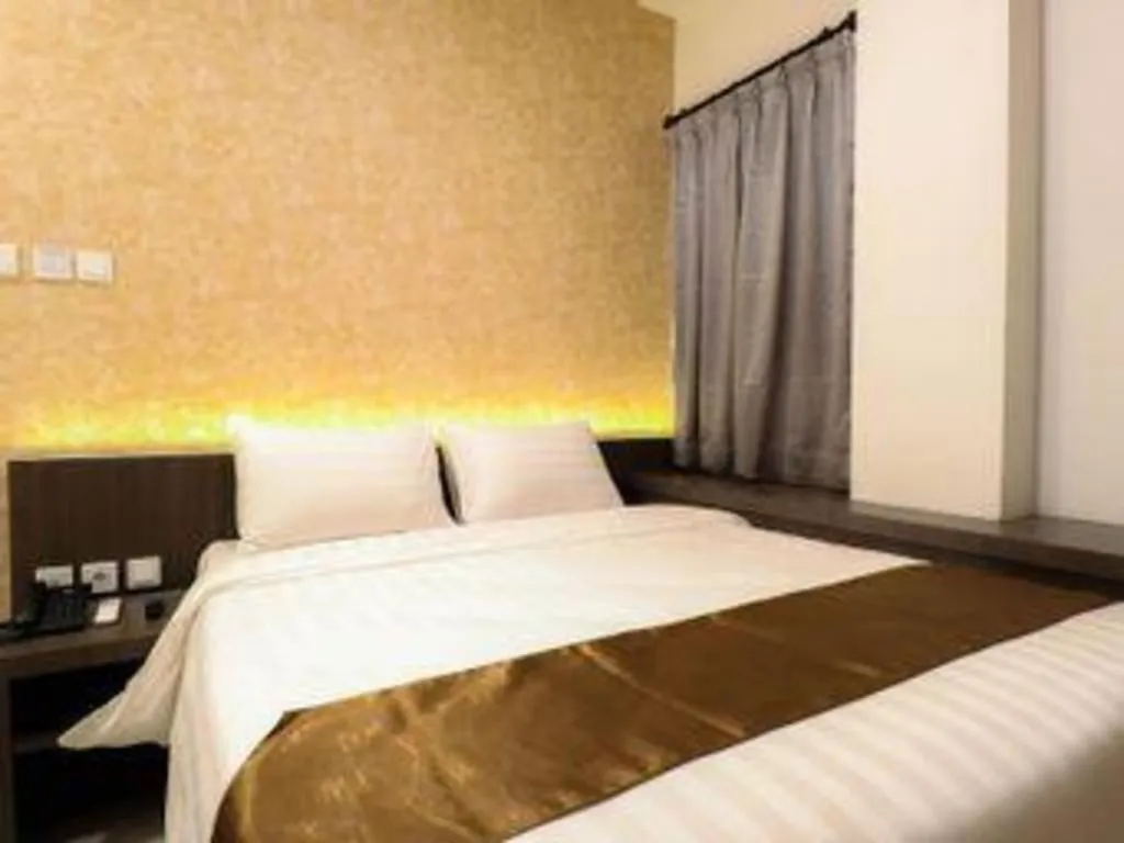 Bed in NIVIA HOTEL