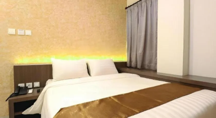 Bed in NIVIA HOTEL
