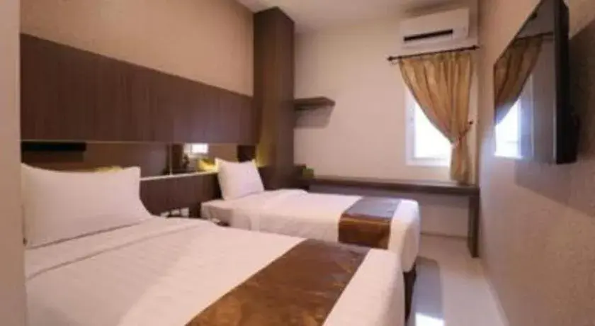 Bed in NIVIA HOTEL Bed in NIVIA HOTEL