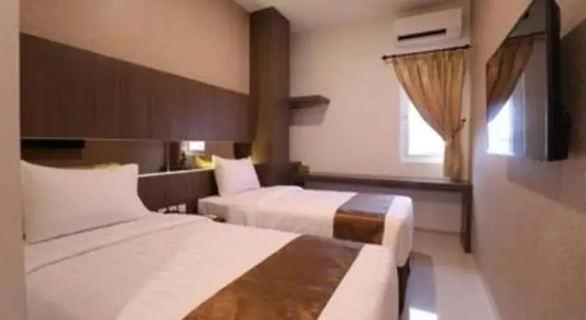 Bed in NIVIA HOTEL Bed in NIVIA HOTEL