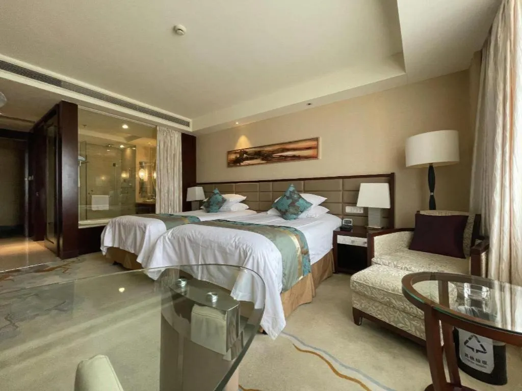 Bed in New Century Grand Hotel Lishui Huaqiao