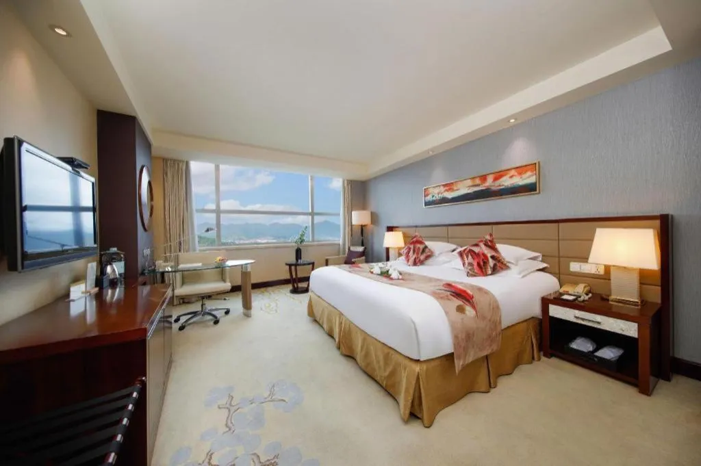 Bed in New Century Grand Hotel Lishui Huaqiao