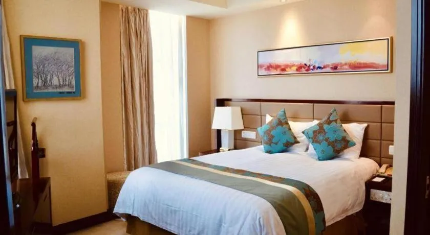 Bed in New Century Grand Hotel Lishui Huaqiao