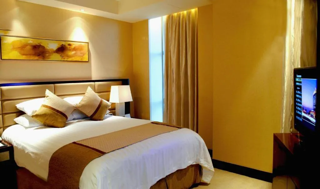 Bed in New Century Grand Hotel Lishui Huaqiao
