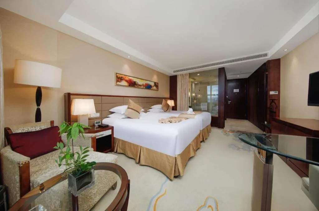 Bed in New Century Grand Hotel Lishui Huaqiao