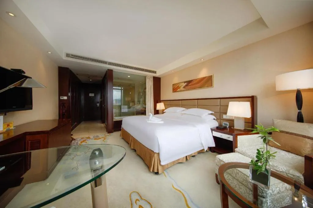 Bed in New Century Grand Hotel Lishui Huaqiao