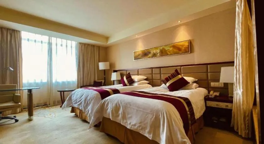 Bed in New Century Grand Hotel Lishui Huaqiao