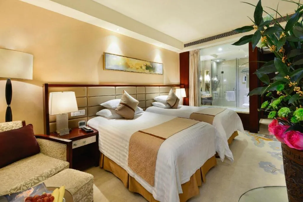 Bed in New Century Grand Hotel Lishui Huaqiao