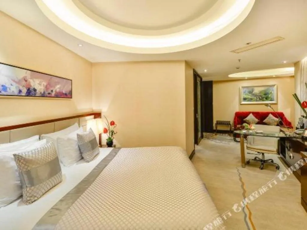 Bed in New Century Grand Hotel Lishui Huaqiao