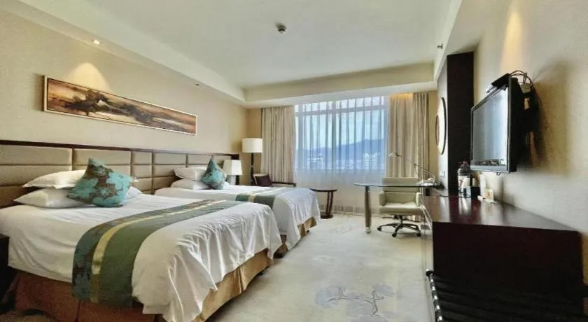 Bed in New Century Grand Hotel Lishui Huaqiao