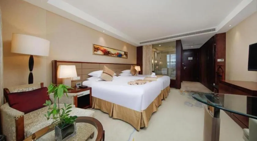 Bed in New Century Grand Hotel Lishui Huaqiao