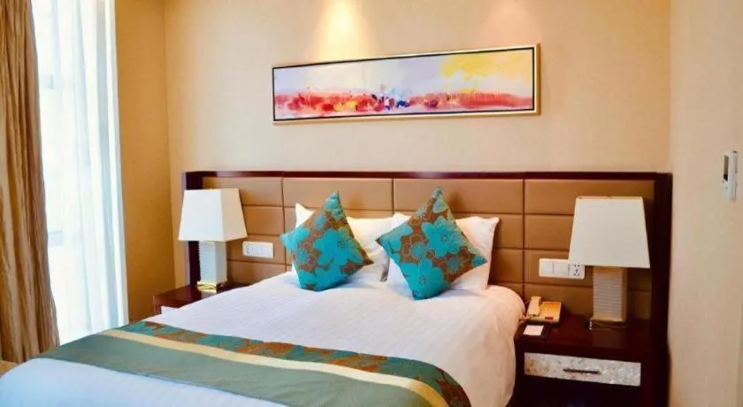 Bed in New Century Grand Hotel Lishui Huaqiao