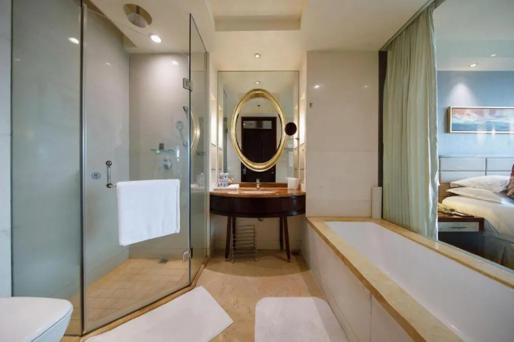 Bed in New Century Grand Hotel Lishui Huaqiao