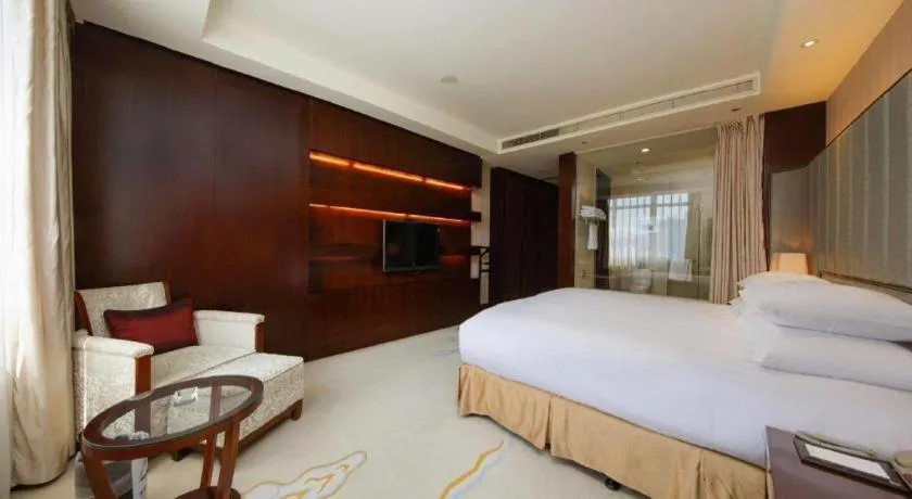 Bed in New Century Grand Hotel Lishui Huaqiao