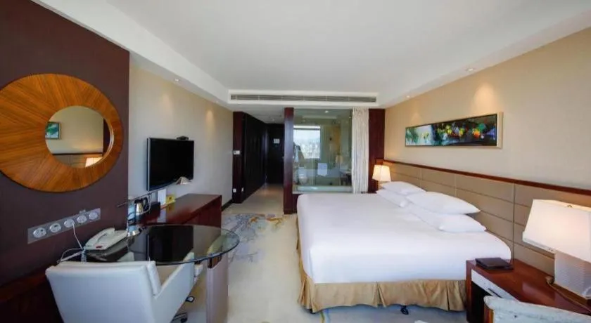 Bed in New Century Grand Hotel Lishui Huaqiao