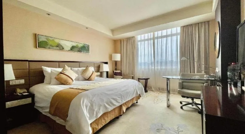 Bed in New Century Grand Hotel Lishui Huaqiao