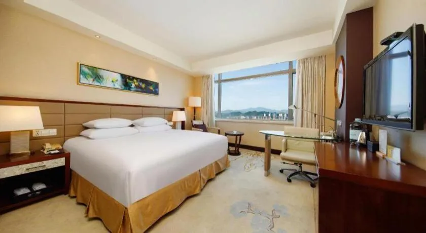 Bed in New Century Grand Hotel Lishui Huaqiao