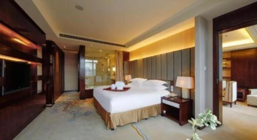 Bed in New Century Grand Hotel Lishui Huaqiao