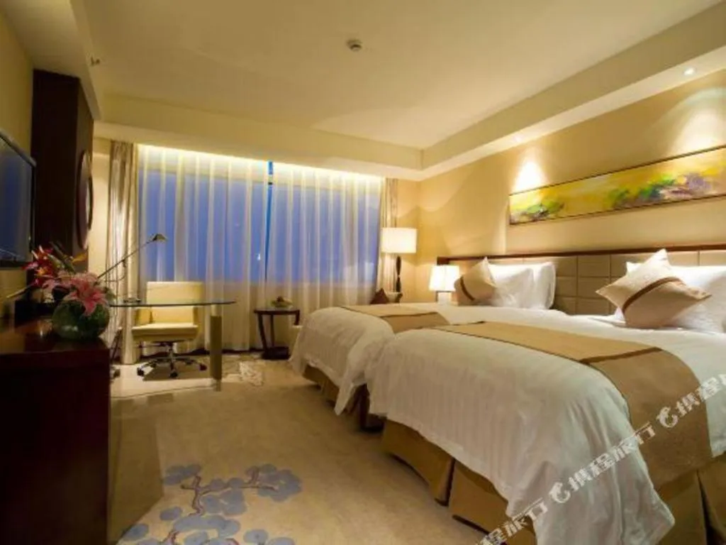 Bed in New Century Grand Hotel Lishui Huaqiao