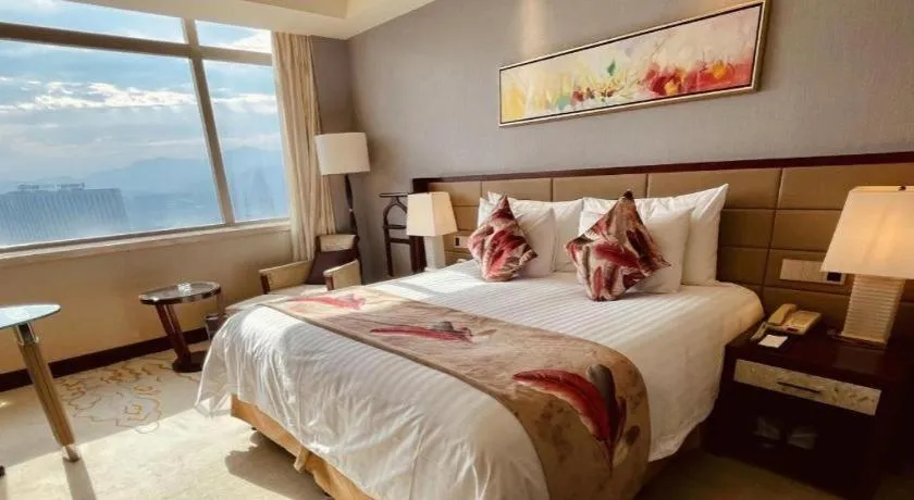 Bed in New Century Grand Hotel Lishui Huaqiao