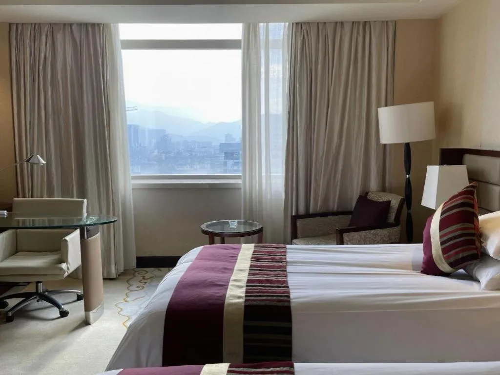 Bed in New Century Grand Hotel Lishui Huaqiao