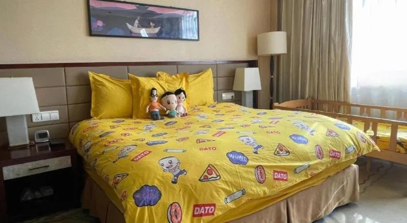 Bed in New Century Grand Hotel Lishui Huaqiao