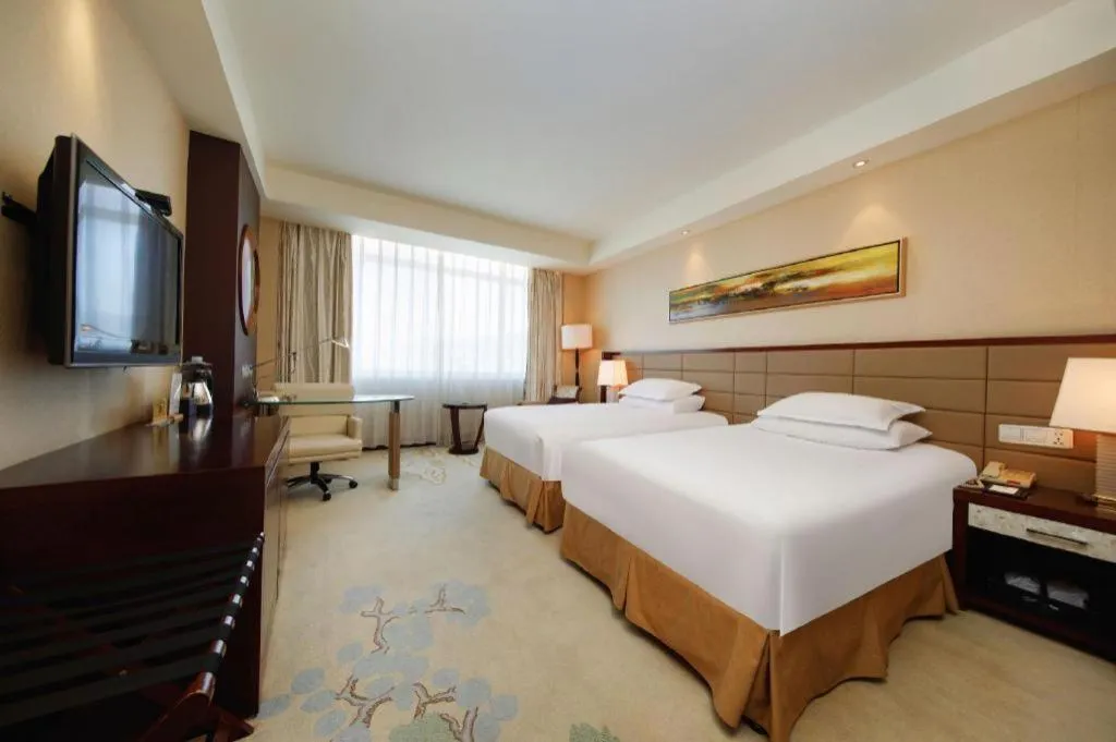 Bed in New Century Grand Hotel Lishui Huaqiao