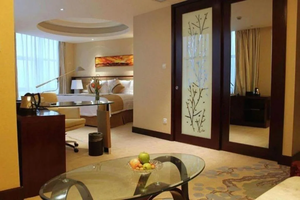 Bed in New Century Grand Hotel Lishui Huaqiao