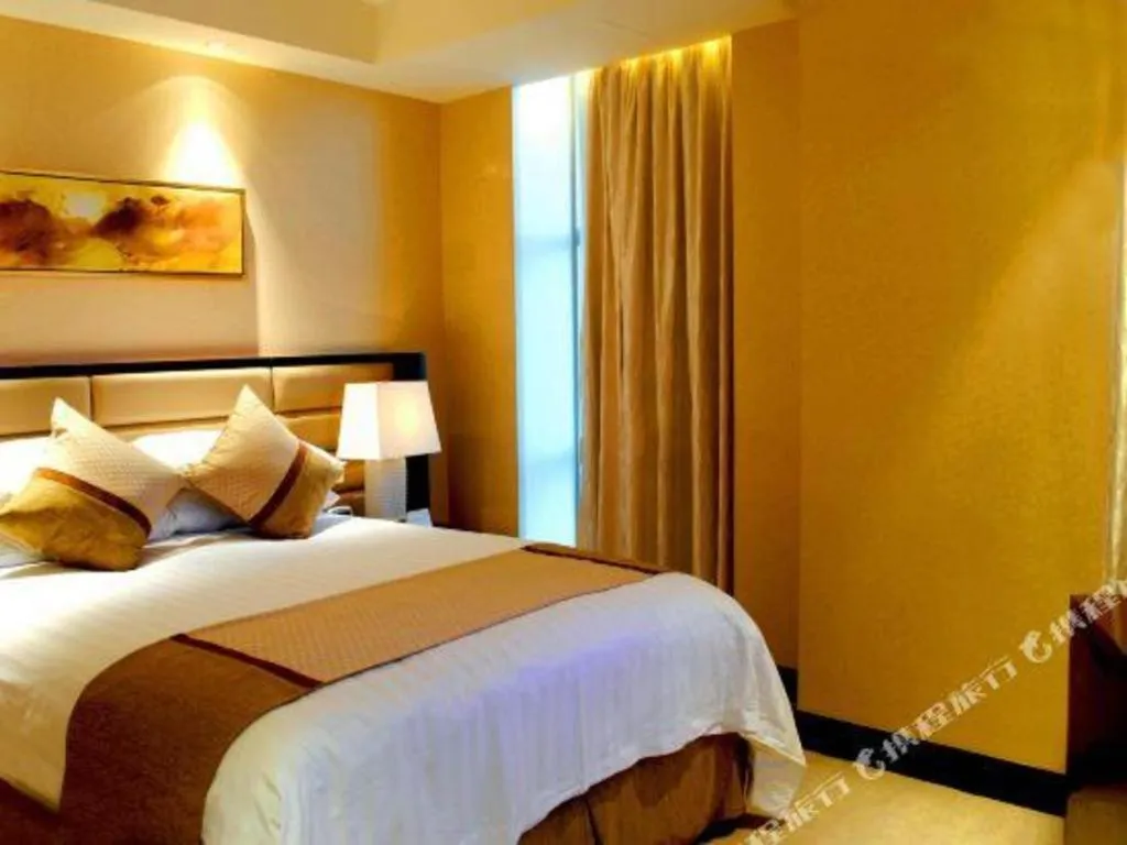 Bed in New Century Grand Hotel Lishui Huaqiao