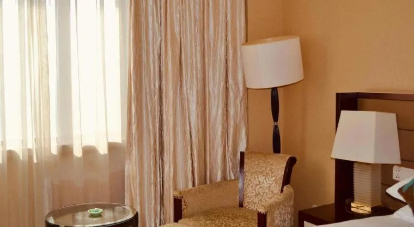 Bed in New Century Grand Hotel Lishui Huaqiao