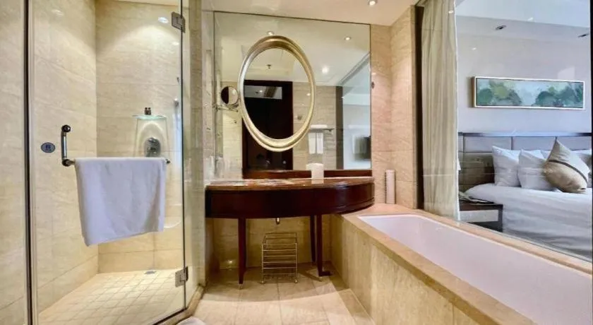 Bed in New Century Grand Hotel Lishui Huaqiao