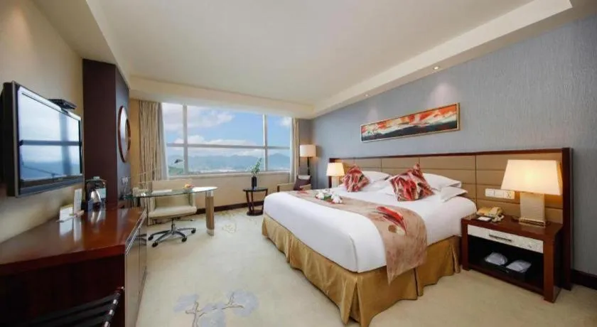Bed in New Century Grand Hotel Lishui Huaqiao