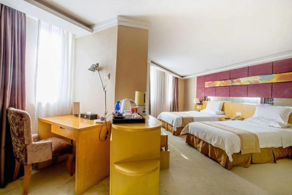 Bed in Zhongshan Louis Hotel