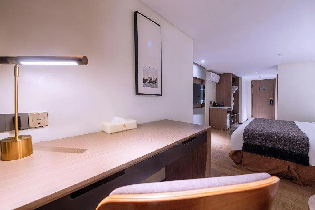 Bed in Zhongshan Louis Hotel