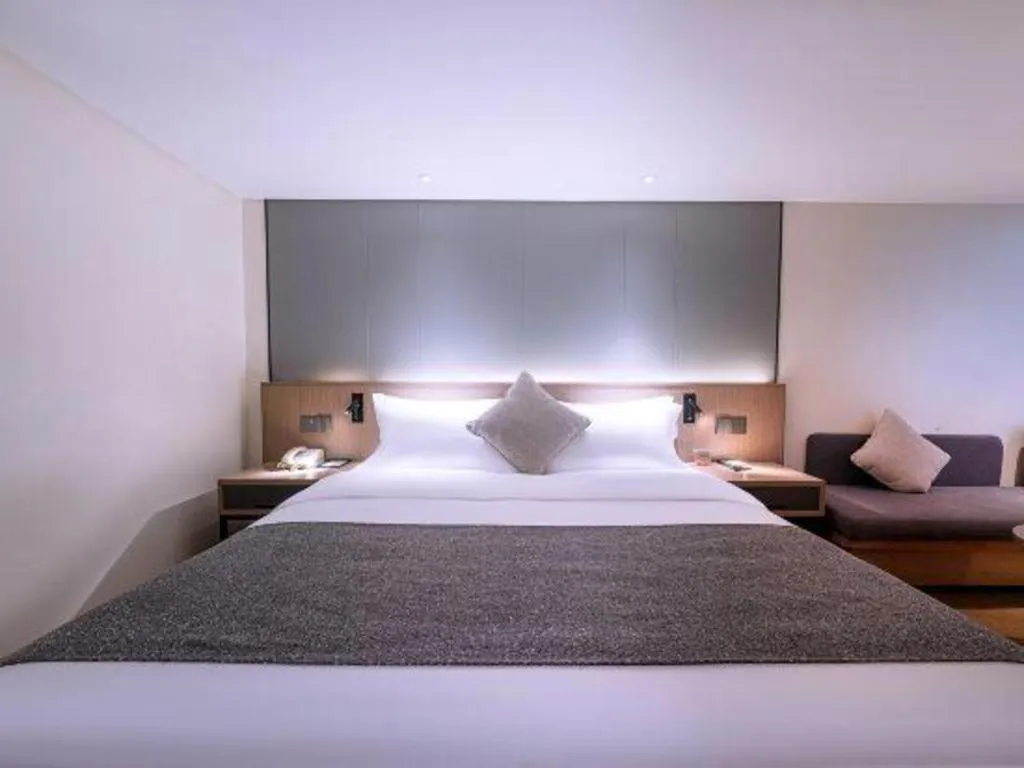 Bed in Zhongshan Louis Hotel