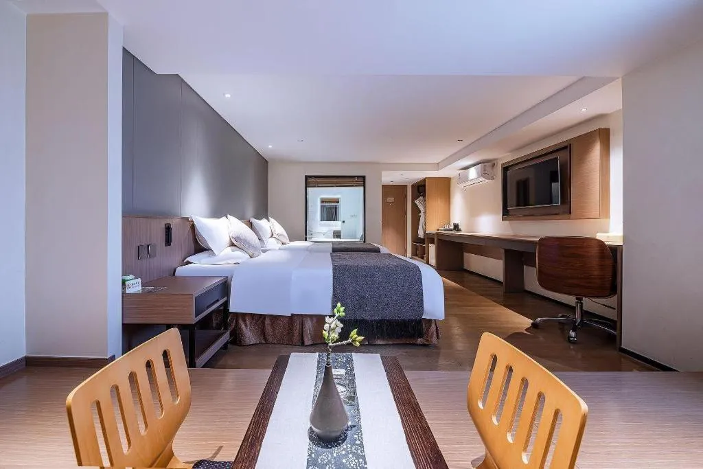 Bed in Zhongshan Louis Hotel