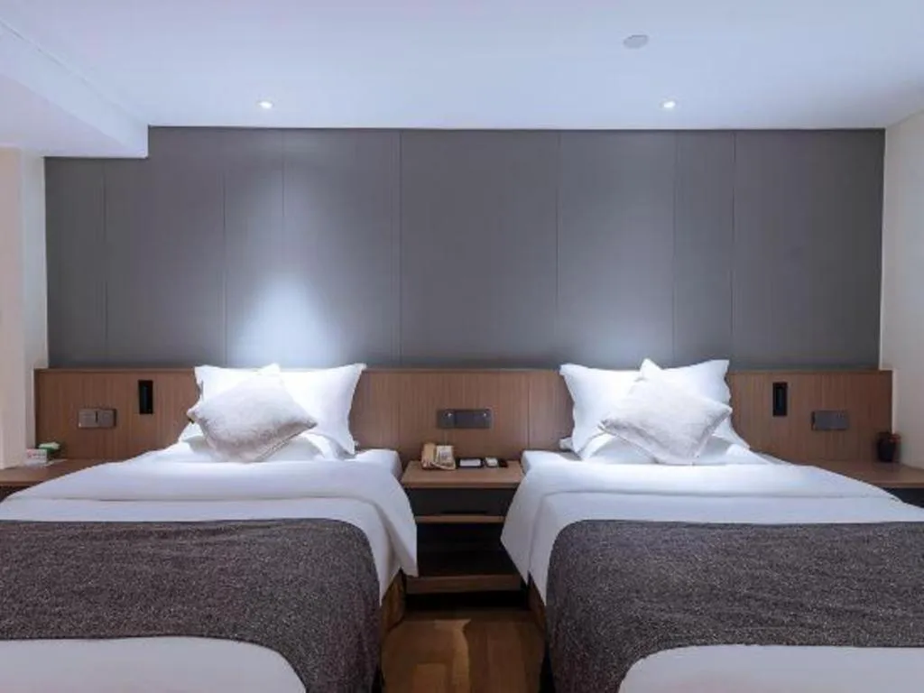 Bed in Zhongshan Louis Hotel